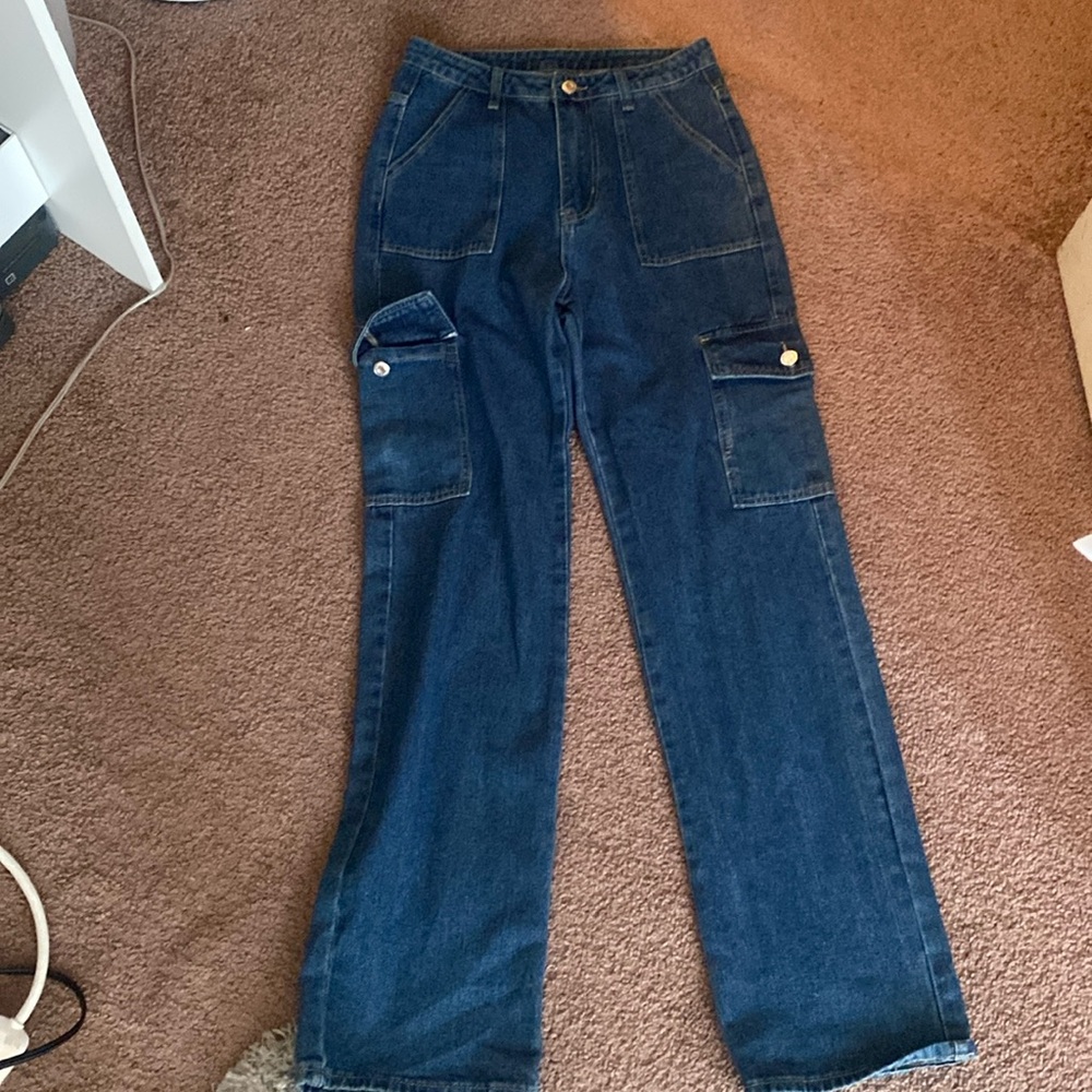 Medium wash oversized cargo jeans.